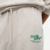 Pantalon de survêtement en tissu éponge à logo script décontracté Pantalon de survêtement en tissu éponge à logo script décontracté