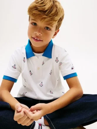 Polo stretch pour enfant avec logo nautique sur toute la surface