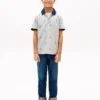 Polo stretch pour enfant avec logo nautique sur toute la surface Polo stretch pour enfant avec logo nautique sur toute la surface