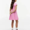 Robe patineuse pour enfant avec logo drapeau ton sur ton Robe patineuse pour enfant avec logo drapeau ton sur ton