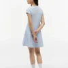 Robe patineuse pour enfant avec logo drapeau ton sur ton Robe patineuse pour enfant avec logo drapeau ton sur ton