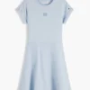Robe patineuse pour enfant avec logo drapeau ton sur ton Robe patineuse pour enfant avec logo drapeau ton sur ton