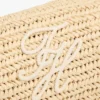 Sac à bandoulière en raphia avec monogramme en lettres cursives Sac à bandoulière en raphia avec monogramme en lettres cursives