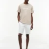 T-shirt rayé avec logo nautique en lettres cursives T-shirt rayé avec logo nautique en lettres cursives