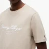 T-shirt rayé avec logo nautique en lettres cursives T-shirt rayé avec logo nautique en lettres cursives